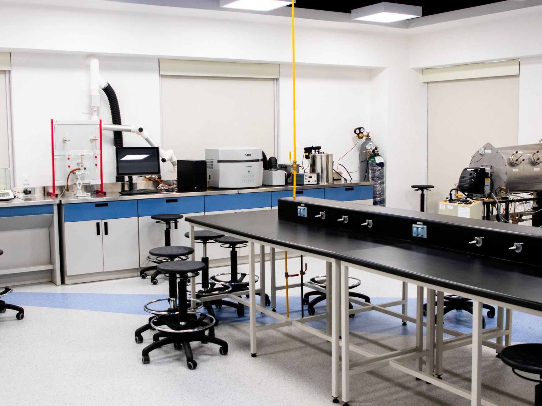 Spacious research laboratory interior with advanced equipment and modern furnishings.